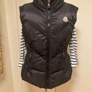 Moncler women black puffer vest. ￼preowned  it iexcellent condition